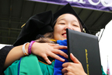 Graduate in Cap and Gown at Commencement Graduate in Cap and Gown at Commencement