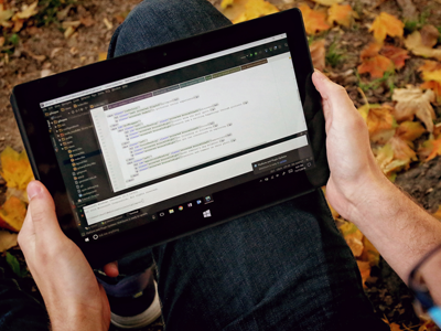 Photo of Devon VanNote '17 Looking at Code on Tablet