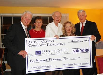 Photo of President Dennis Receiving the Allison Cassens Scholarship Check