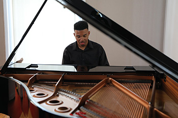 Male Student Playing Piano