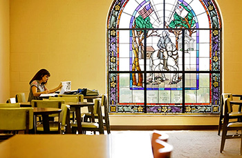 Student Studying in Holman Library Student Studying in Holman Library
