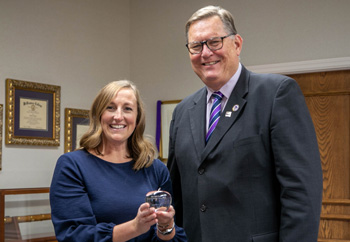 Dr. Sara Frank and President Dobbins with Award